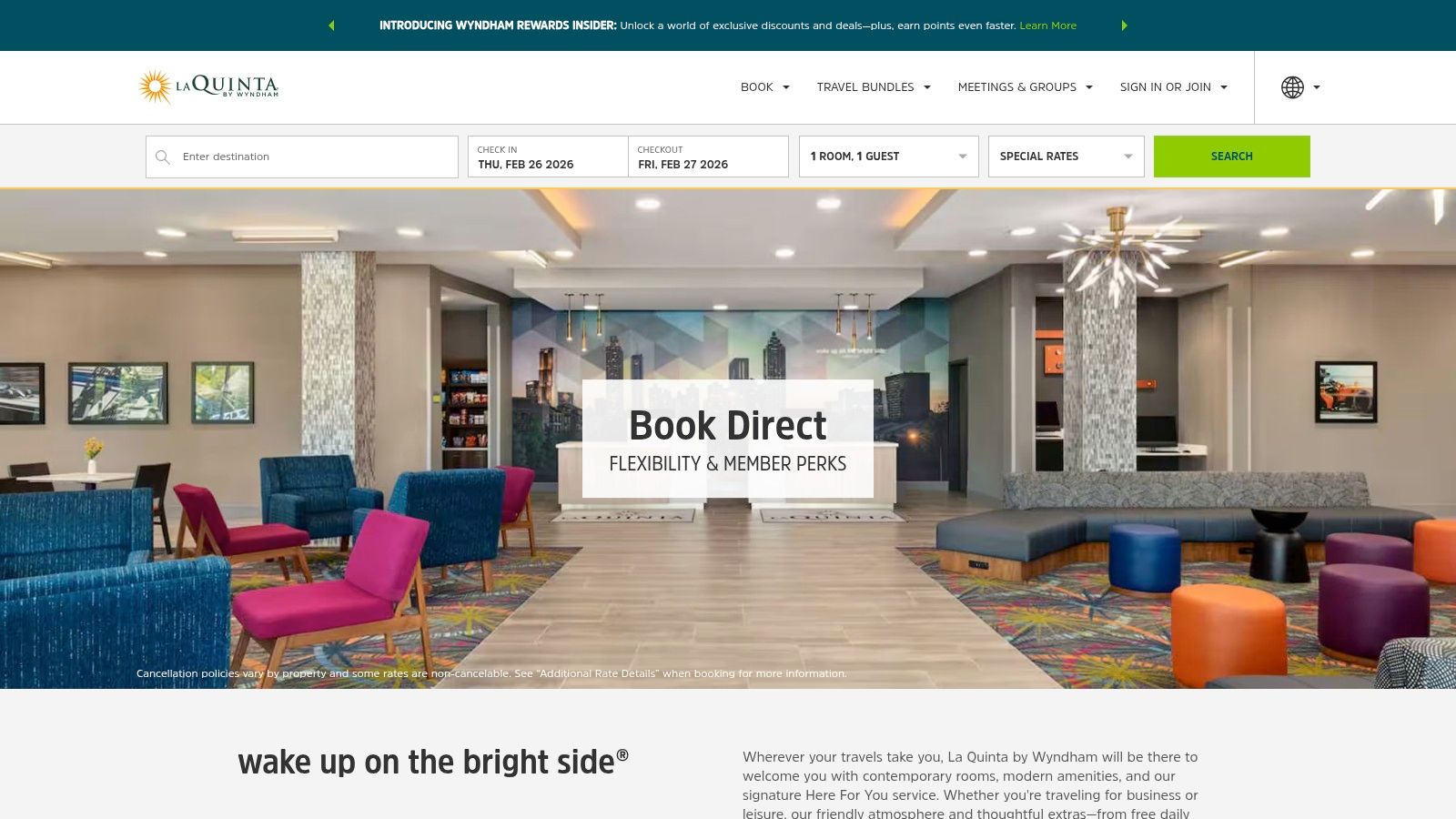 A bright, modern La Quinta by Wyndham hotel lobby, showing a welcoming seating area.