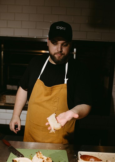 person writing on a piece of paper