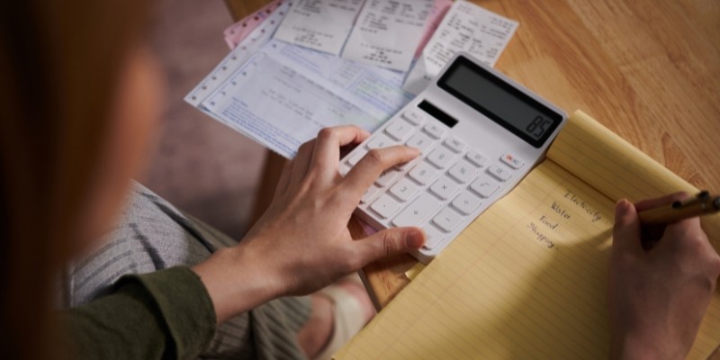 Business owner analysing cost for business