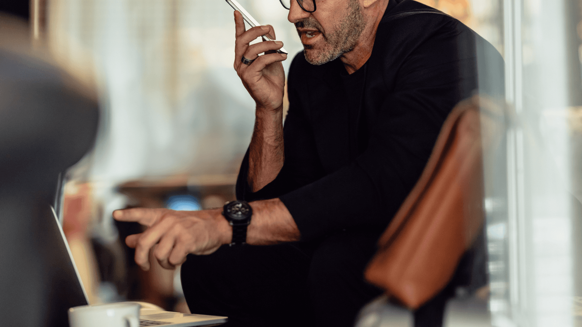 A CEO working at their desk, focused on leading their startup