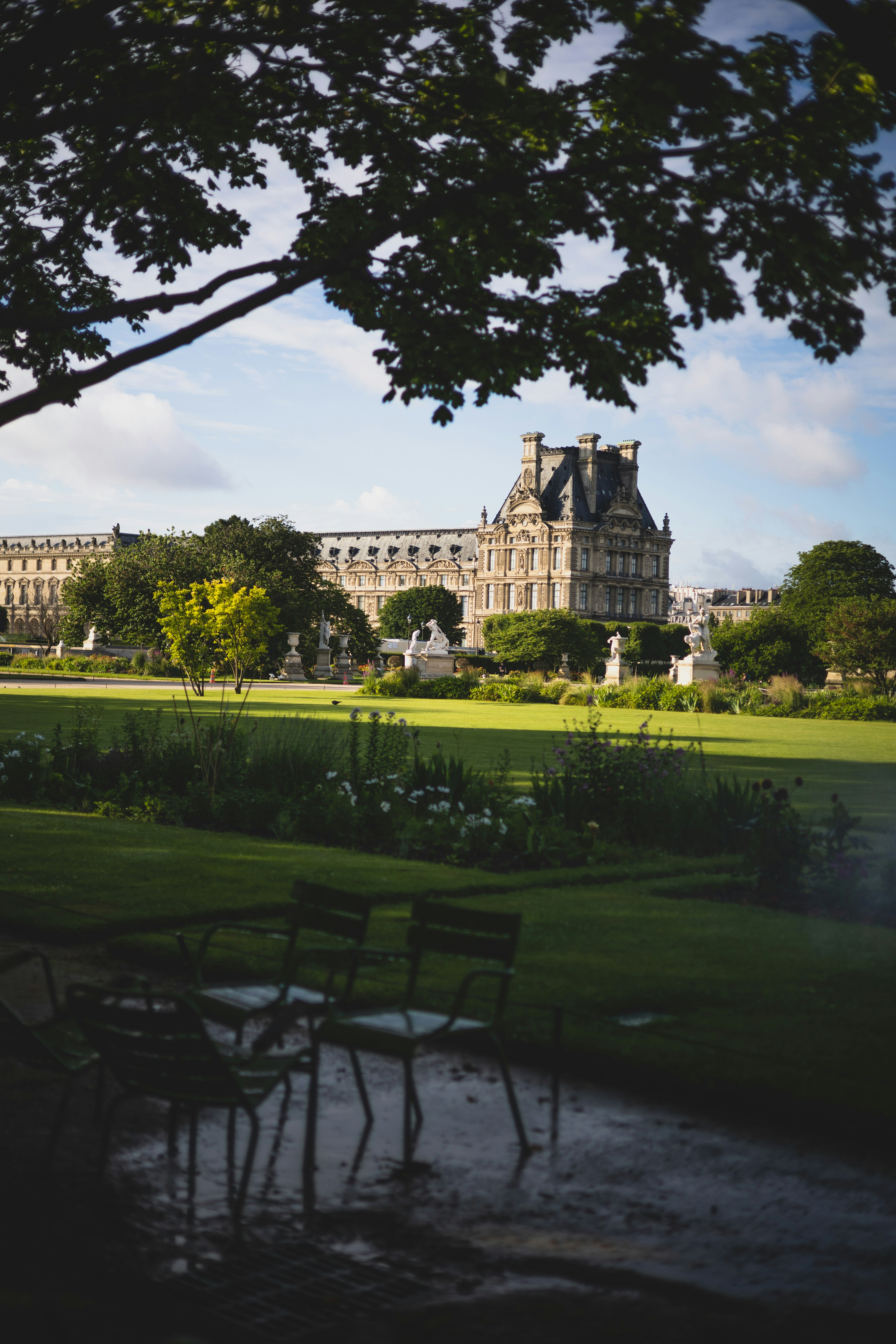 green grass field near white concrete building during daytime