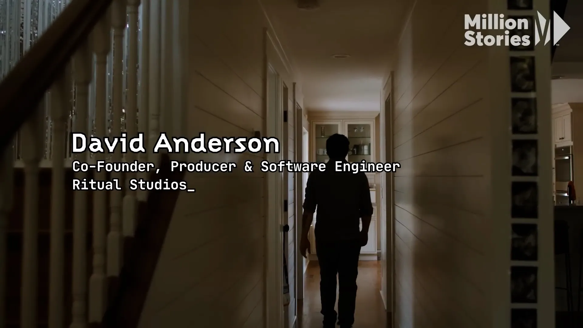 Interview subject walking down a hallway in a documentary-style shot