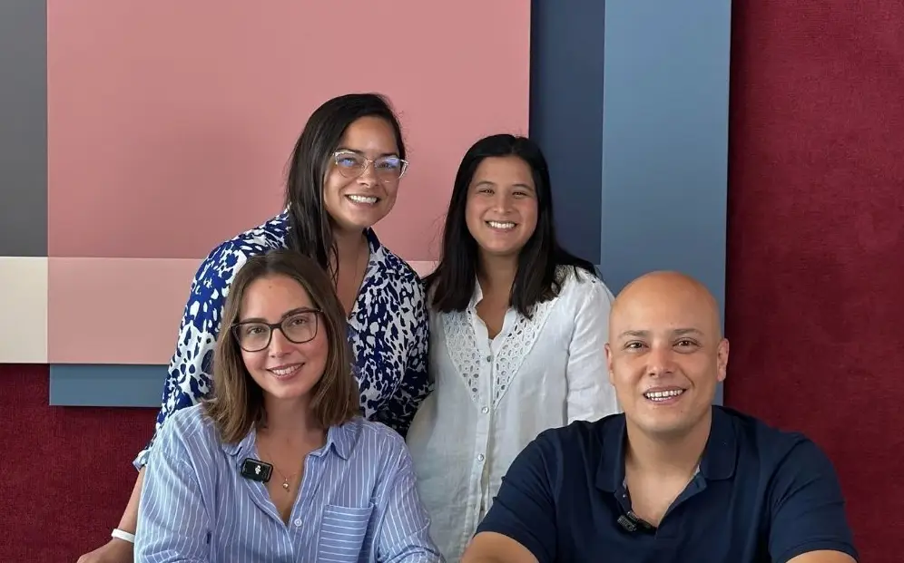 man in black crew neck t-shirt and blue shorts holding woman in white and red