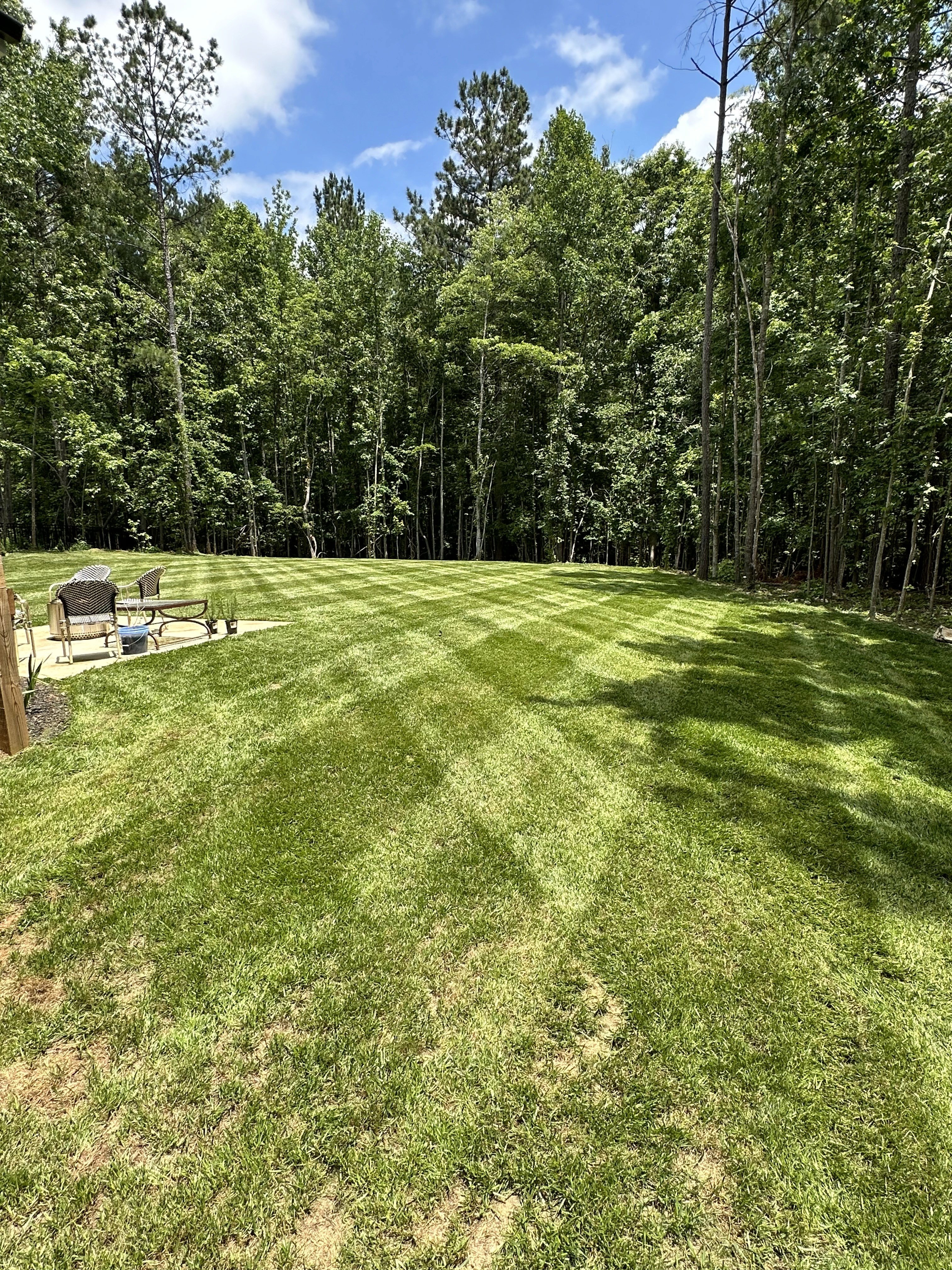 a man in a yellow shirt is working on a roof