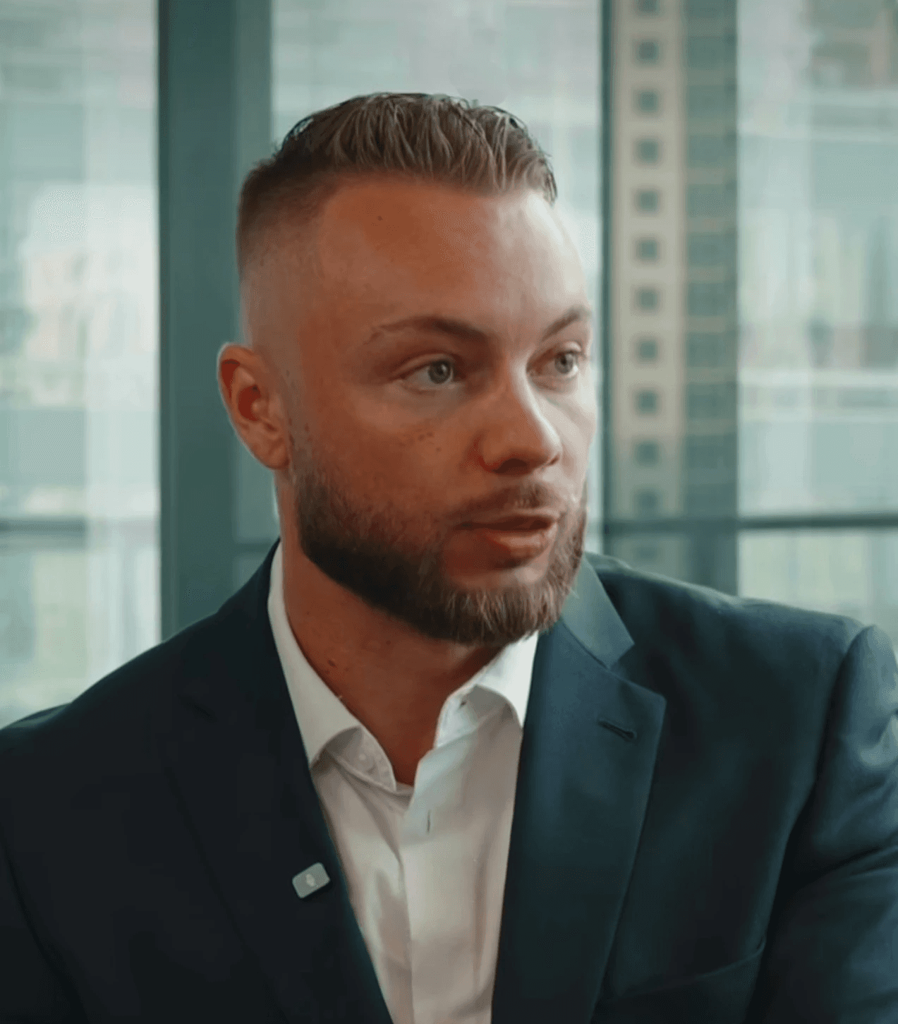 Woman in pink sweater indoors.
