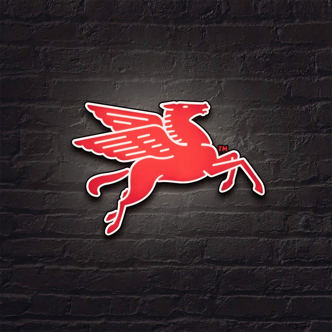An LED Mobil 1 Pegasus sign on a brick wall