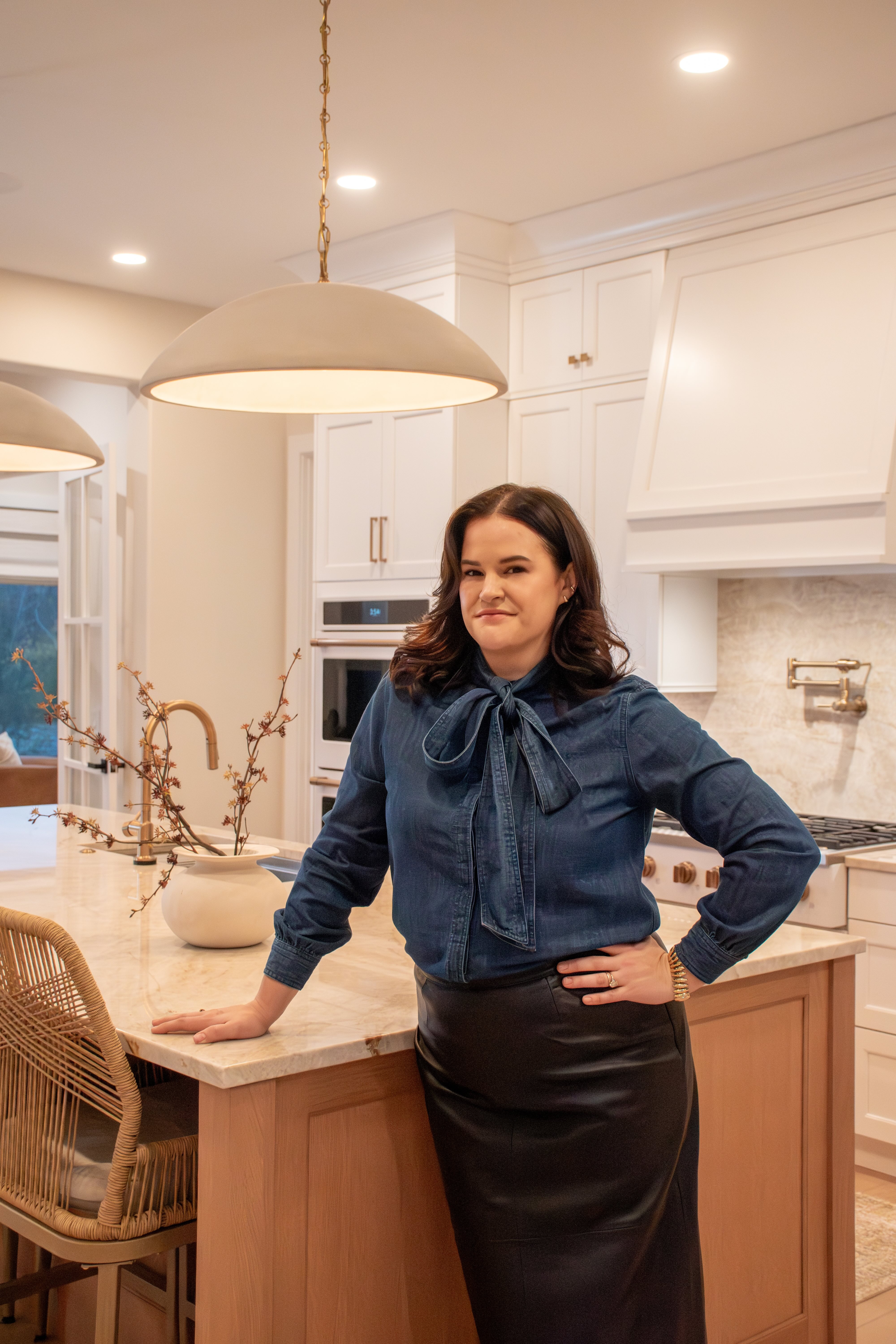 Lindsay Mindler, Co-Founder of Glintera and owner of interior design studio Sage and Gray, in a client kitchen