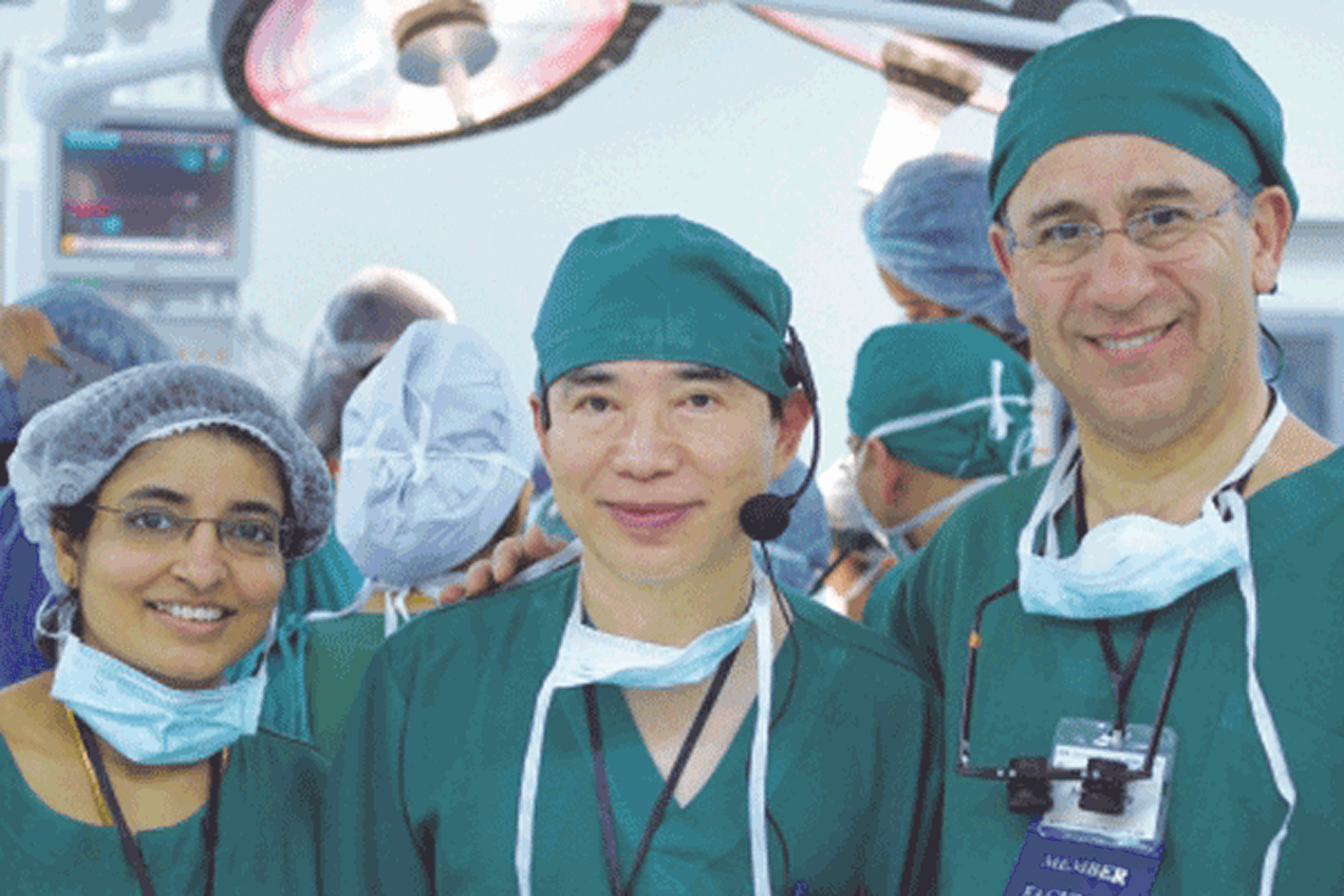 Dr.Radha Rani with Dr. Damkerng Pathomvanich and Dr. Alex Ginzburg in a live surgery