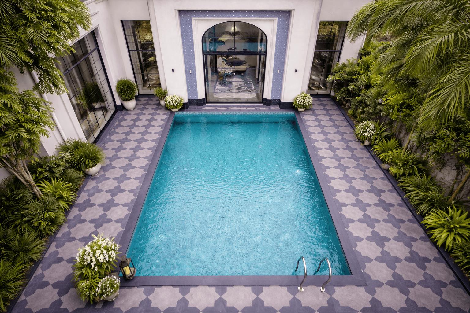 Star stone flooring integrated with landscape and poolside walkway in contemporary residential design