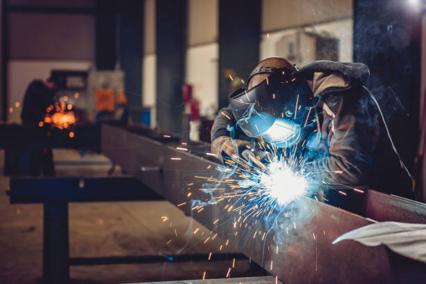 image of a person wearing protective gear welding some metal together