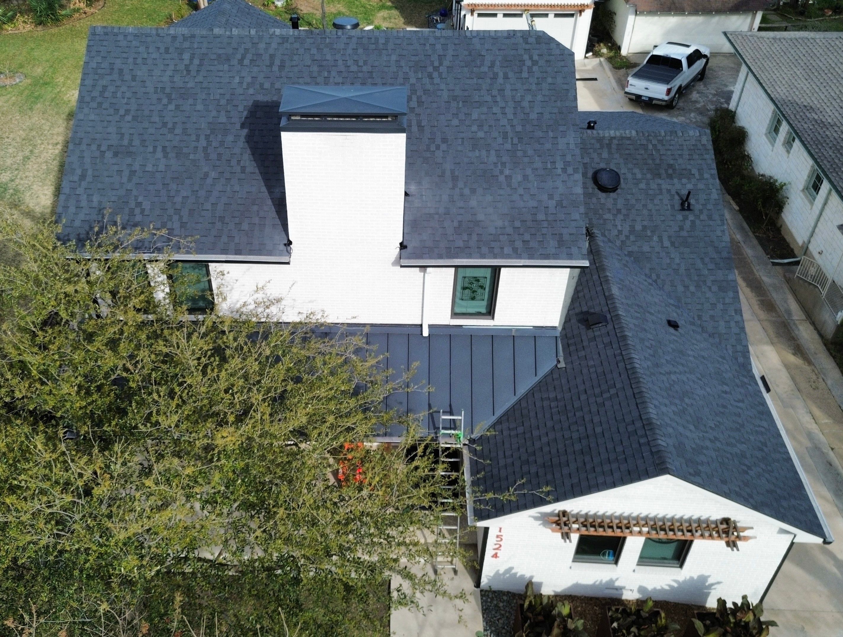 Aerial view of the completed roof showing the chimney with new counter flashing