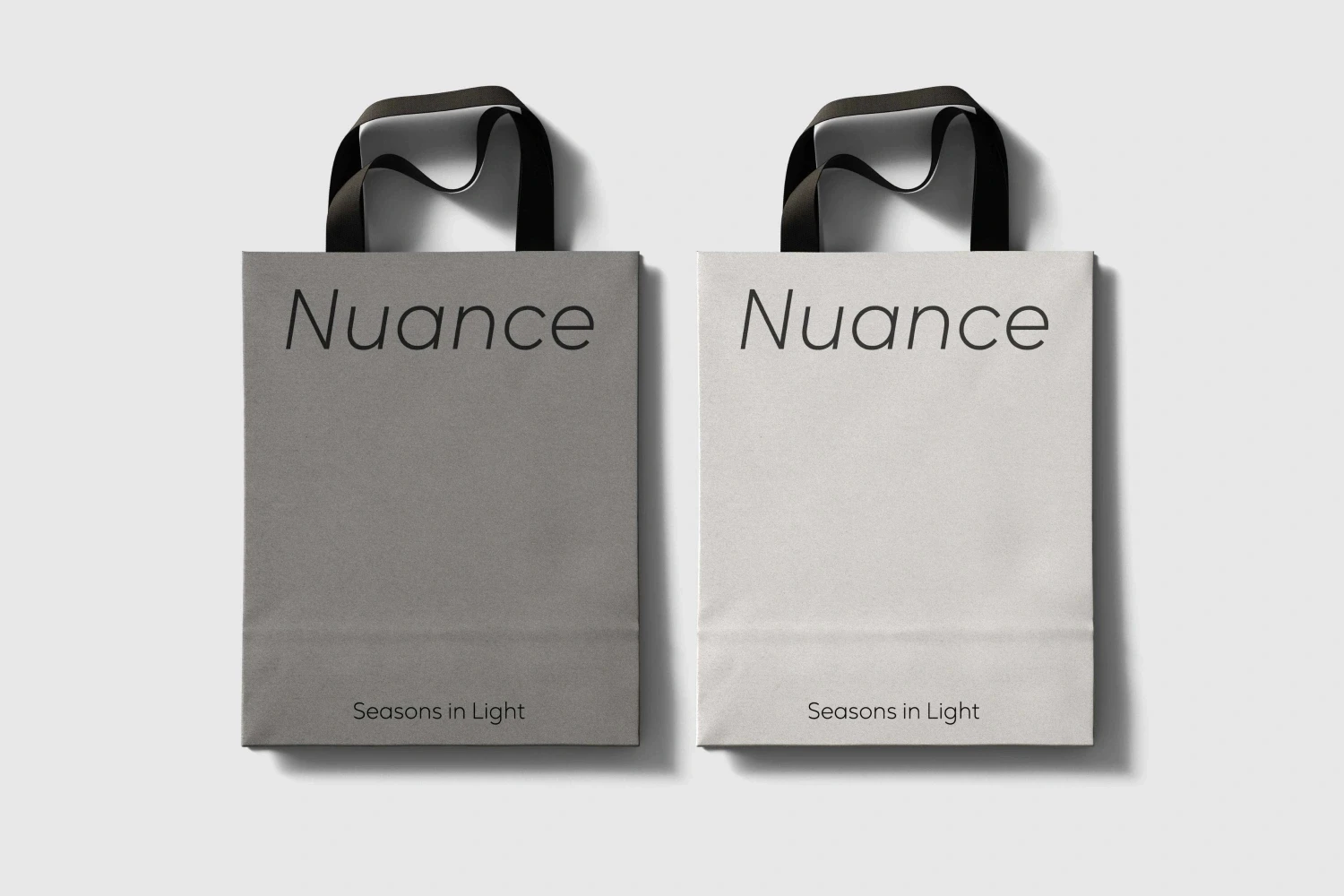 Shopping bags featuring the brand ‘Nuance’ set in Oktah Neue for a clean minimalist font design