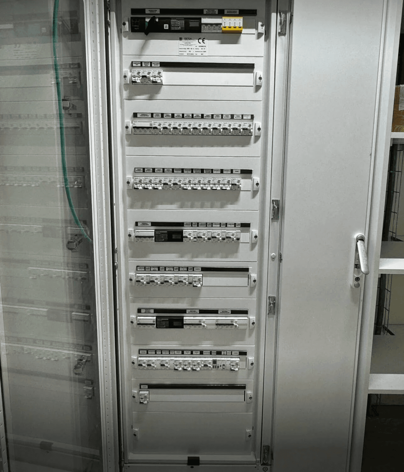 Modern bathroom featuring wooden cabinetry, a bathtub, a sleek sink, and natural light from a window.