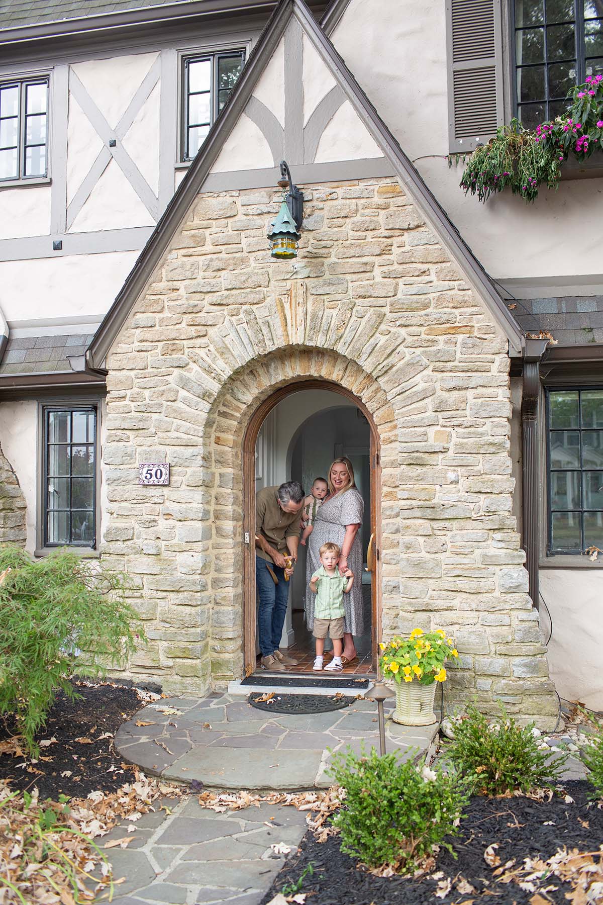 brown wooden house with green plants