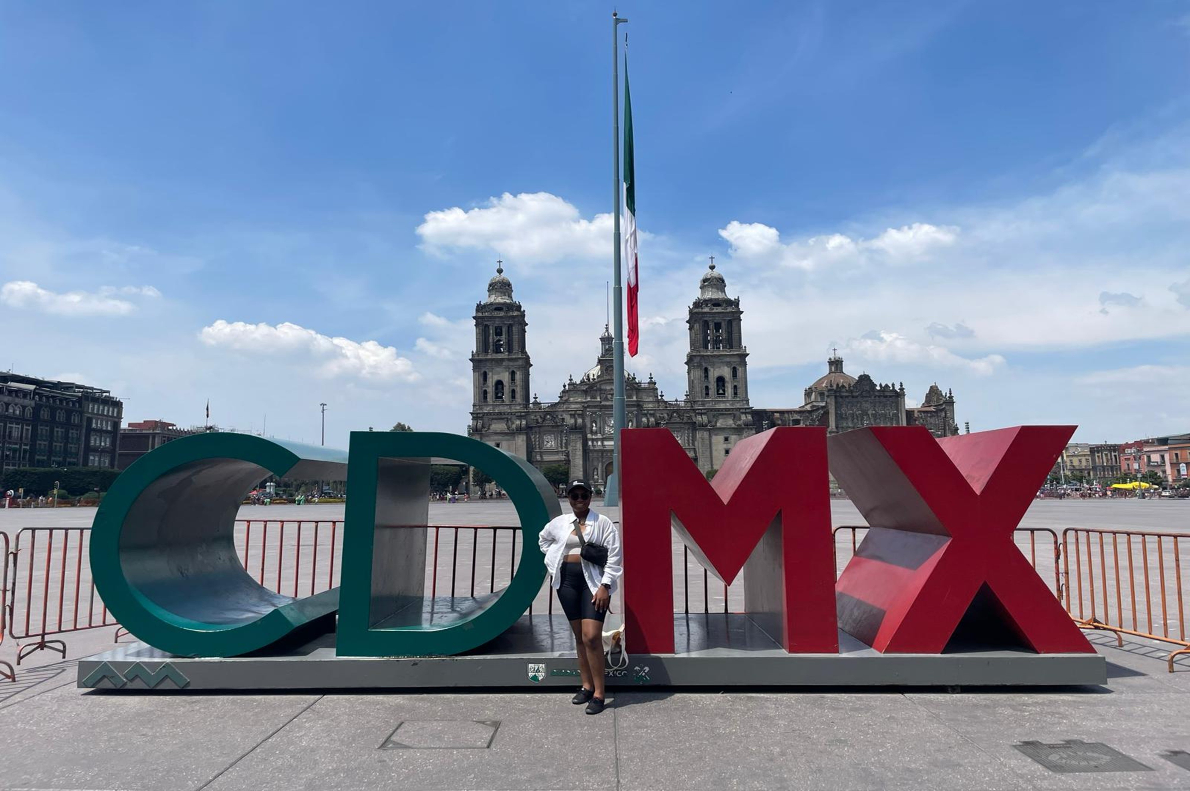 woman stading in front of sign