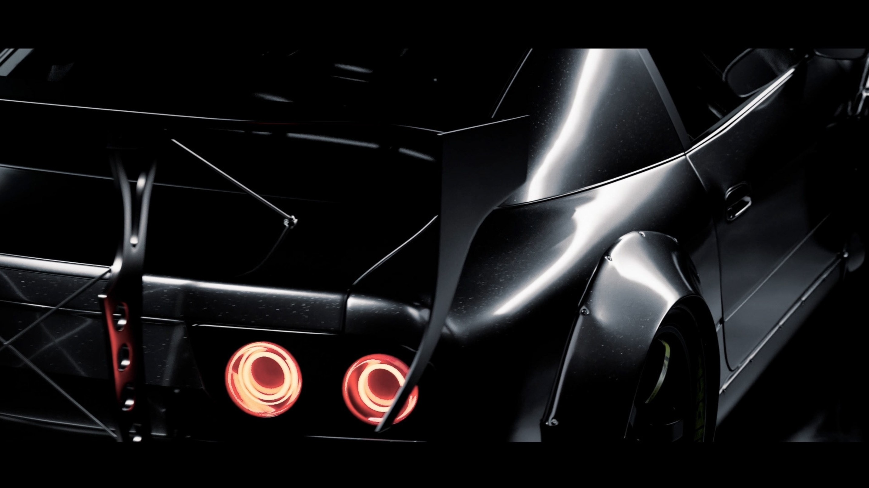 Detailansicht des gerenderten Fahrzeughecks mit Rückleuchten, Diffusor und Carbon-Elementen