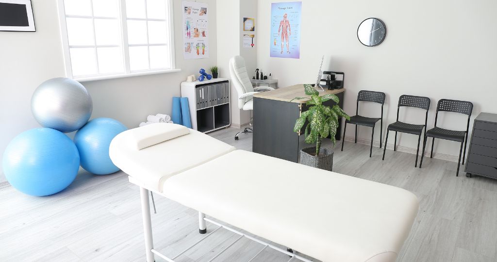 Chiropractic clinic with a treatment table and exercise balls