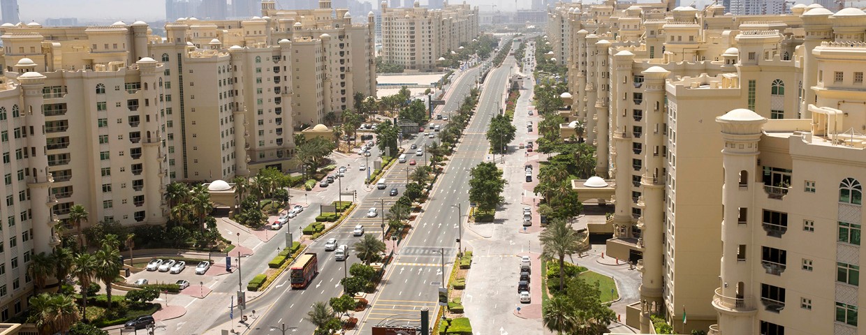 Beachfront view of Shoreline Apartments at Marina Bay, Dubai, featuring contemporary architecture and coastal scenery.