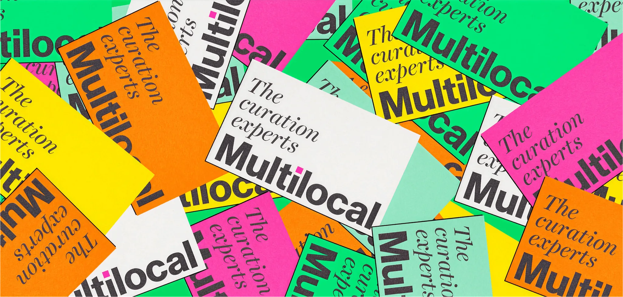 Scattered Multilocal cards in bright colours reading The curation experts