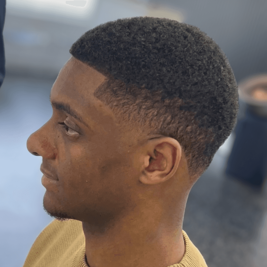 person holding white and gold hair comb