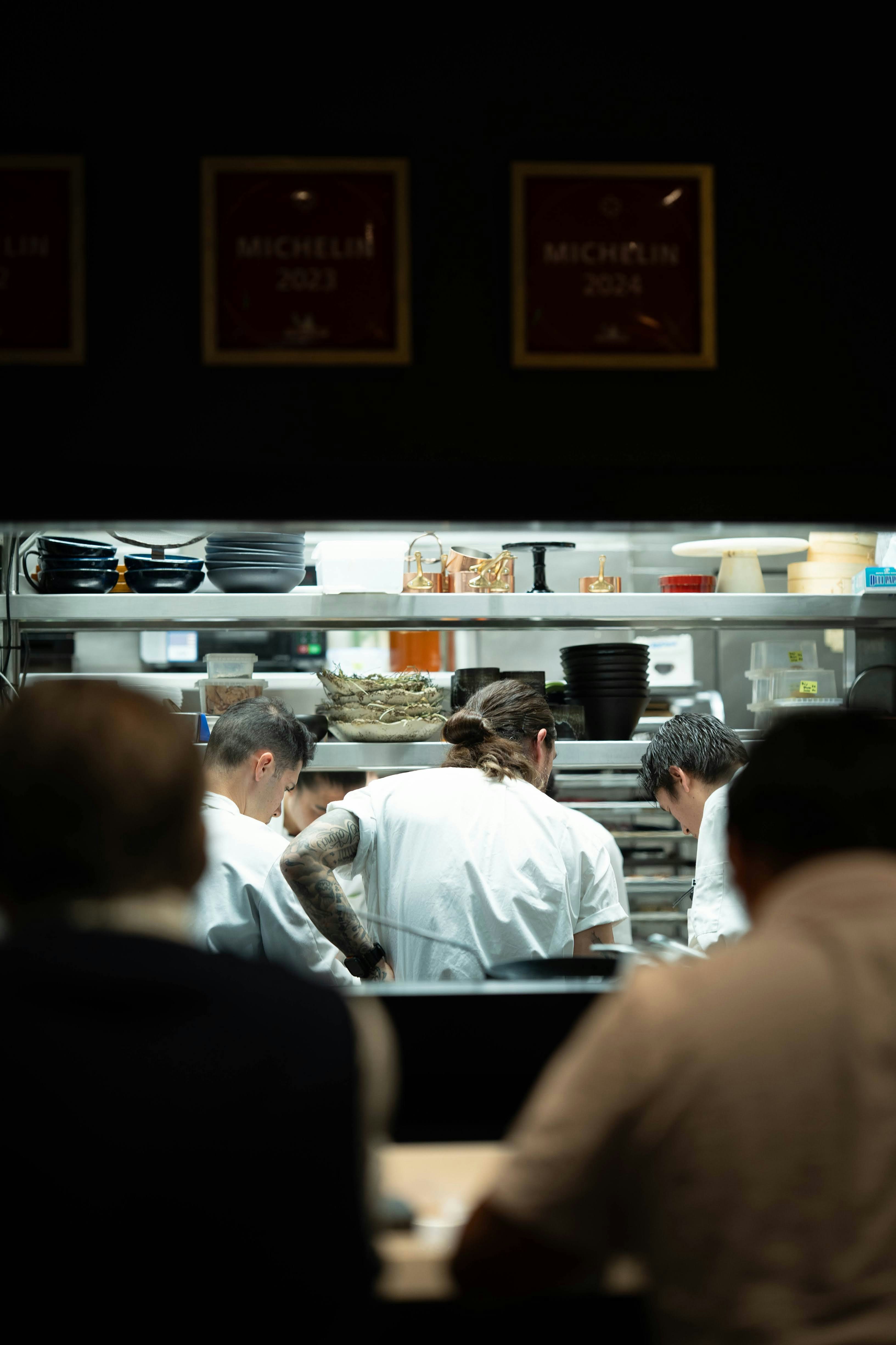 Chefs working in a busy restaurant kitchen