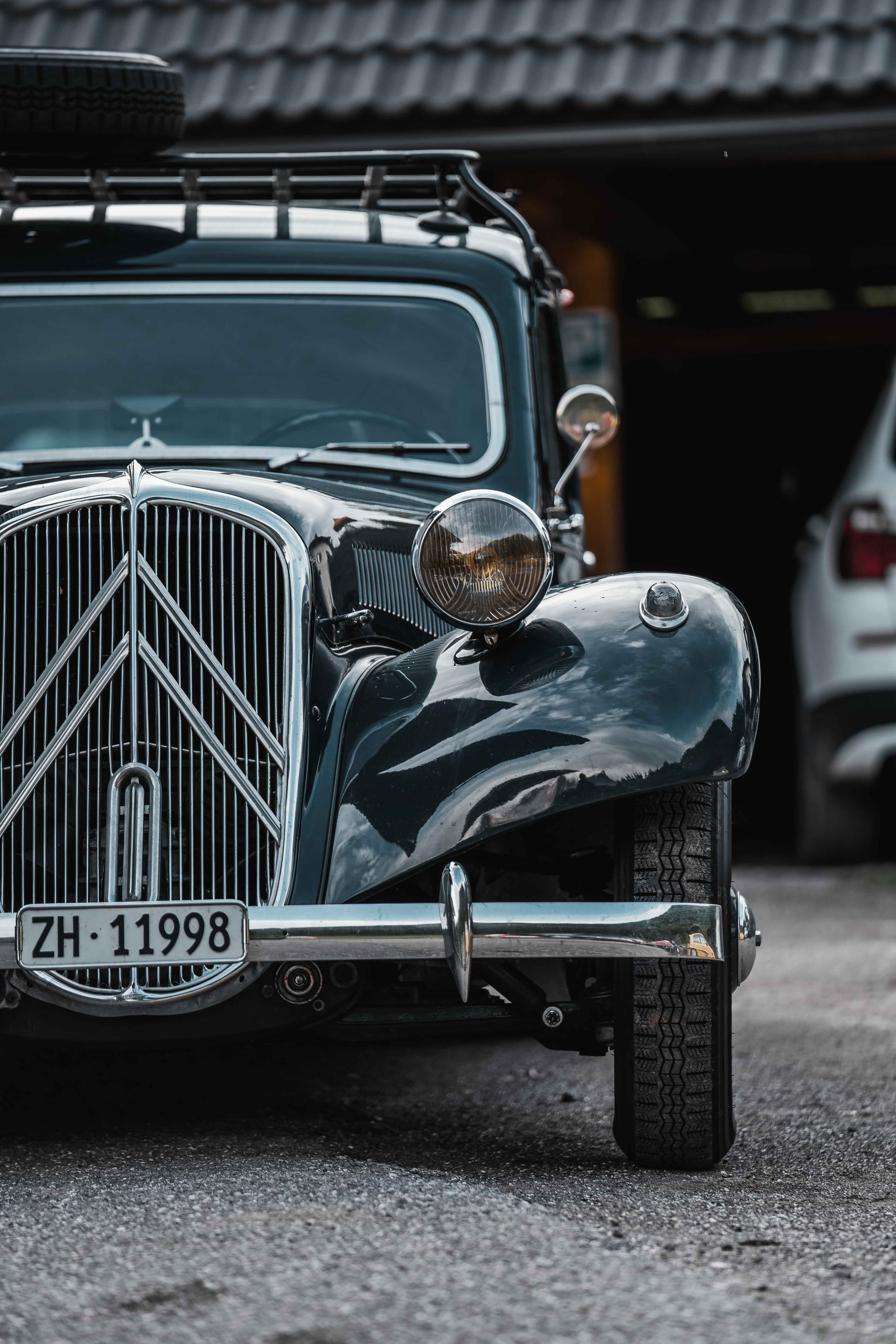 Traveler walking across golden dunes in AlUla desert under clear blue sky.