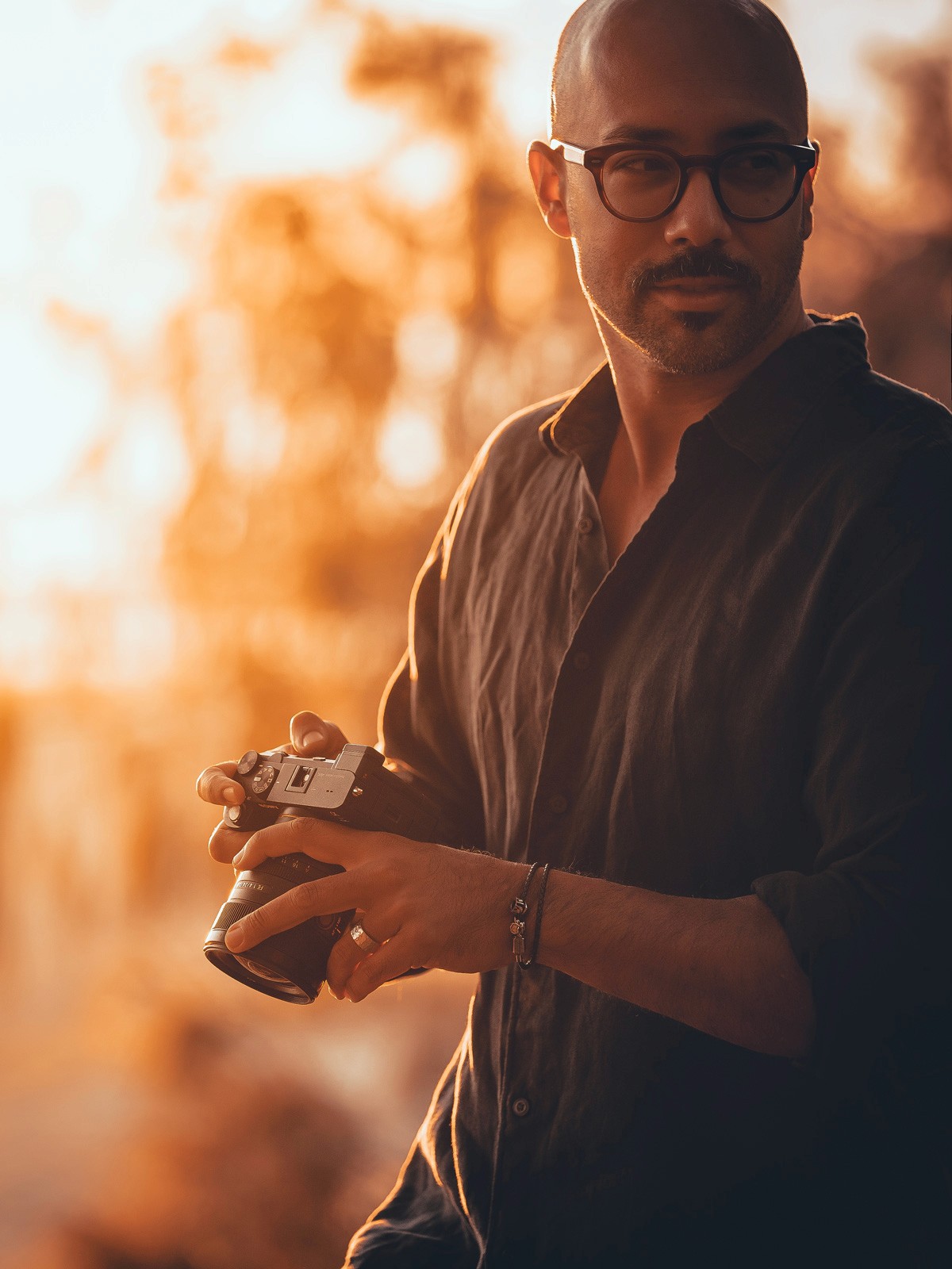 Elf woman in white dress raising hands by the river