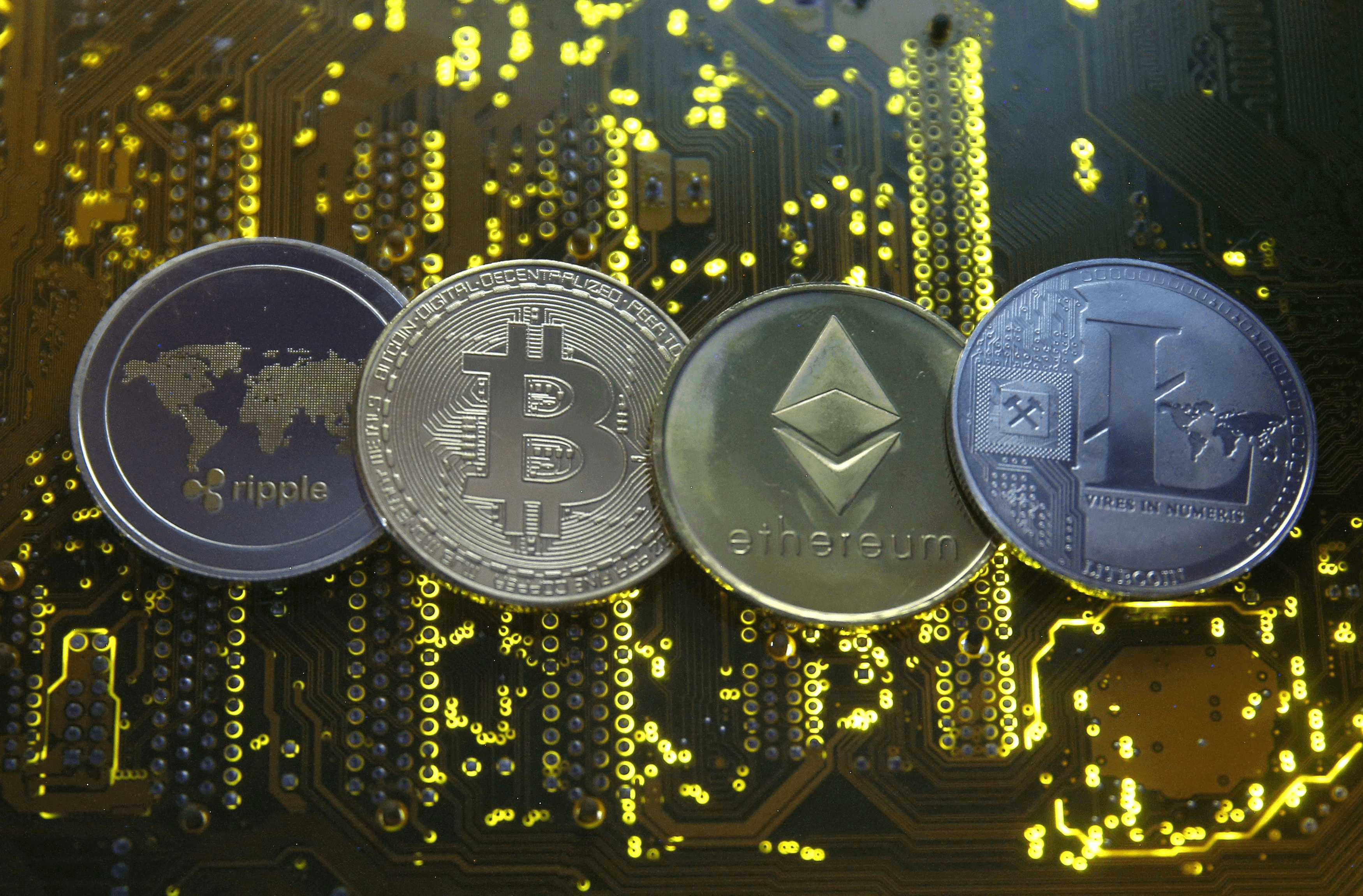 Various cryptocurrencies on circuit board - Tokenomics Crypto