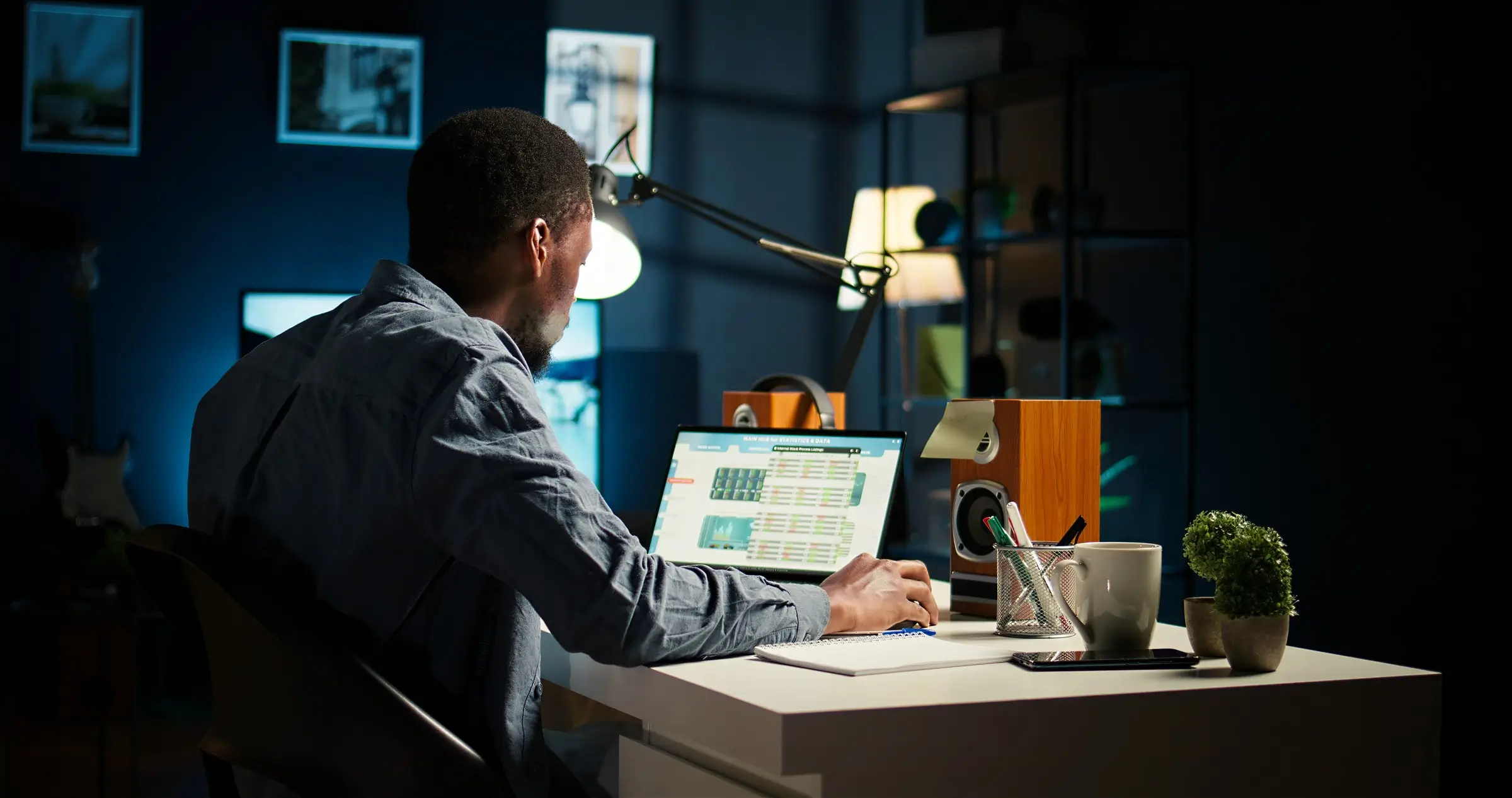 Working late at a glowing laptop, visitors arriving after hours