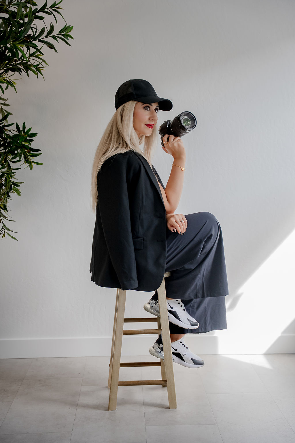 A couple stands outdoors at sunset.