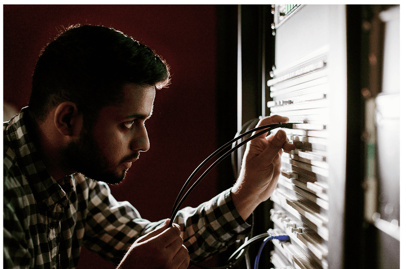 Man connecting wires