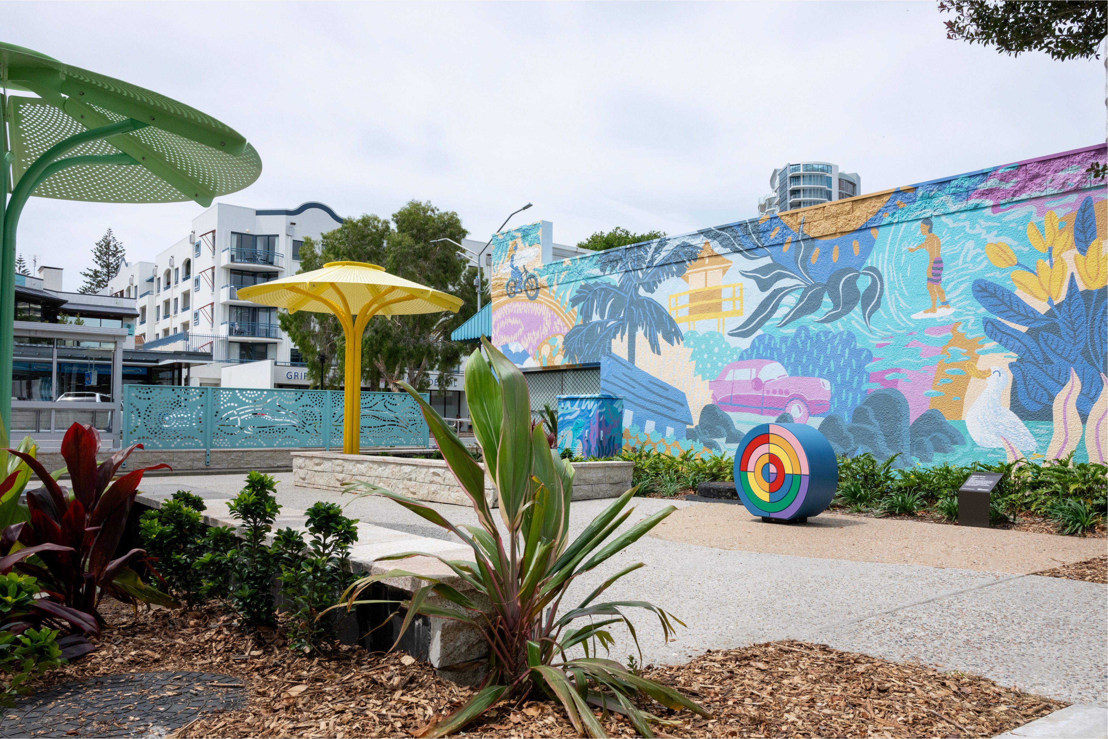 An image of Griffith Street, Coolangatta capturing the new murals, instalations and shade structures