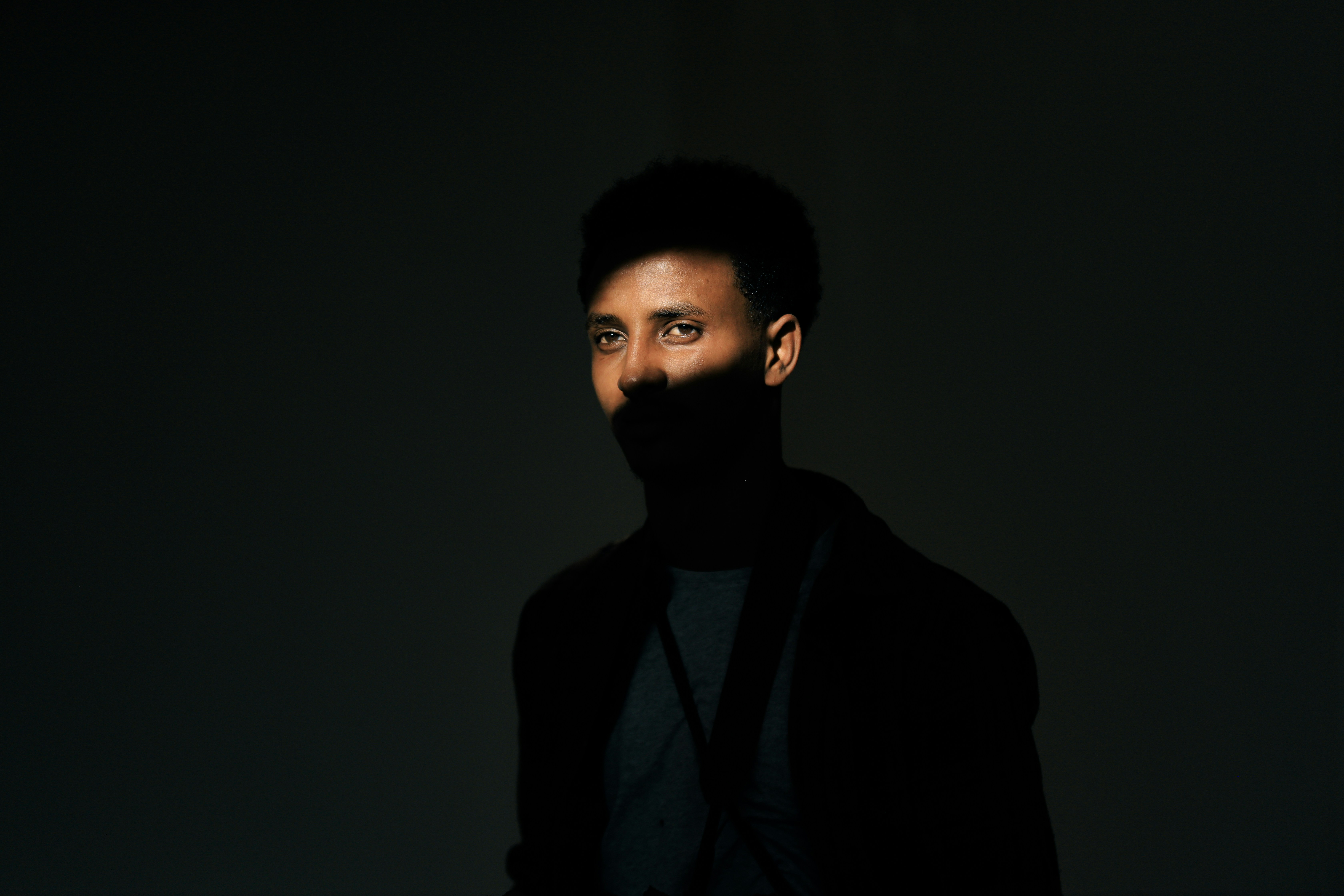 a man with a beard and a black shirt