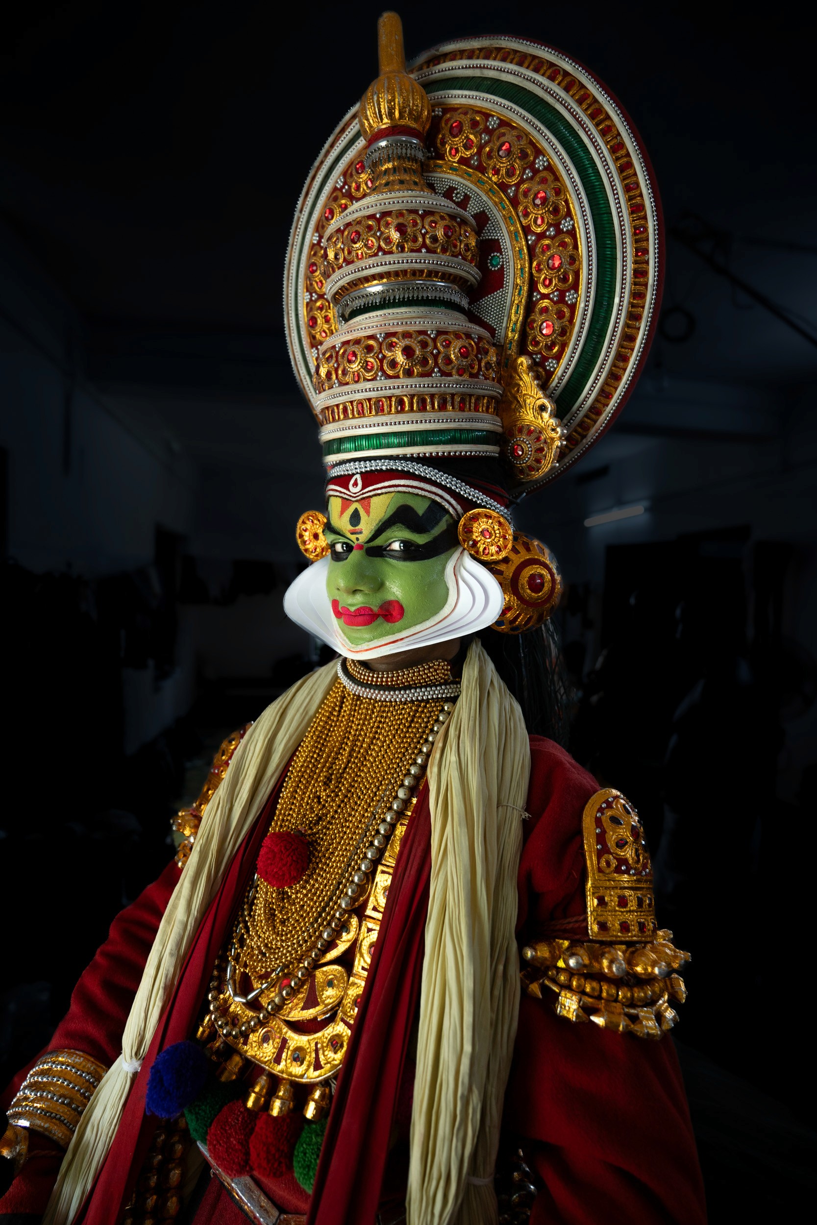 The Green Discipline - Every line, curve, and color in Kathakali is codified by centuries of tradition. The green pigment (*Pacha*) signifies nobility and divine order.