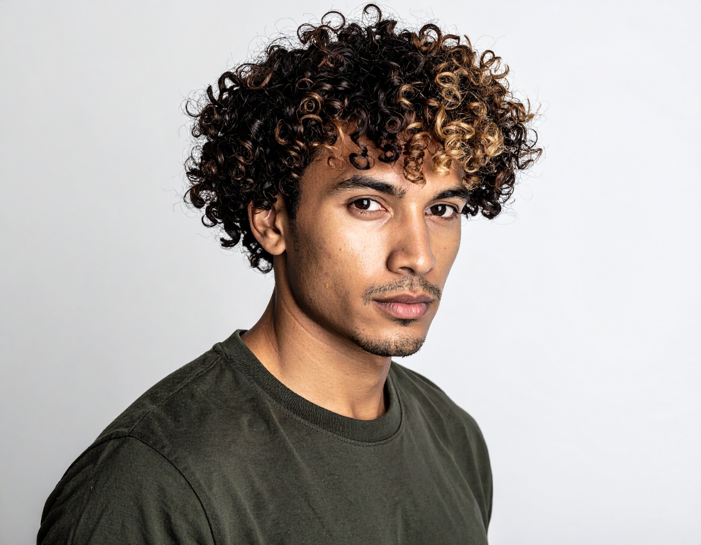 man with short curly hair