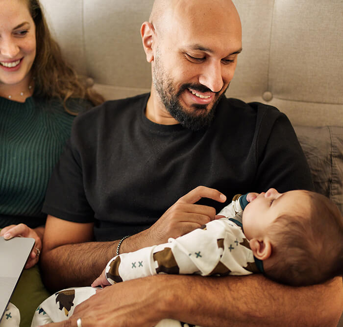 dad holding baby son