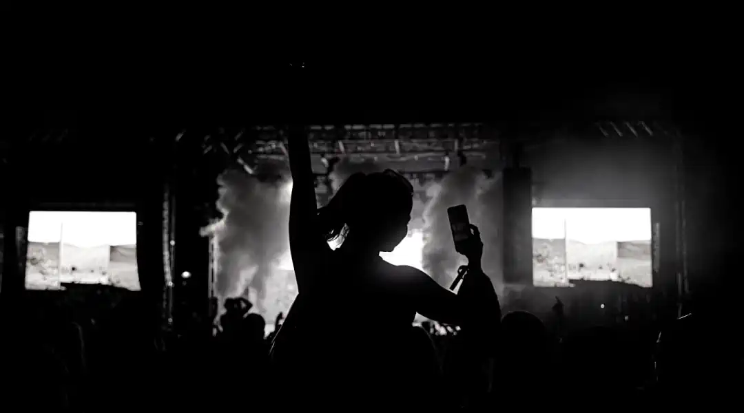 Uncommon Entertainment concert with a person's silhouette