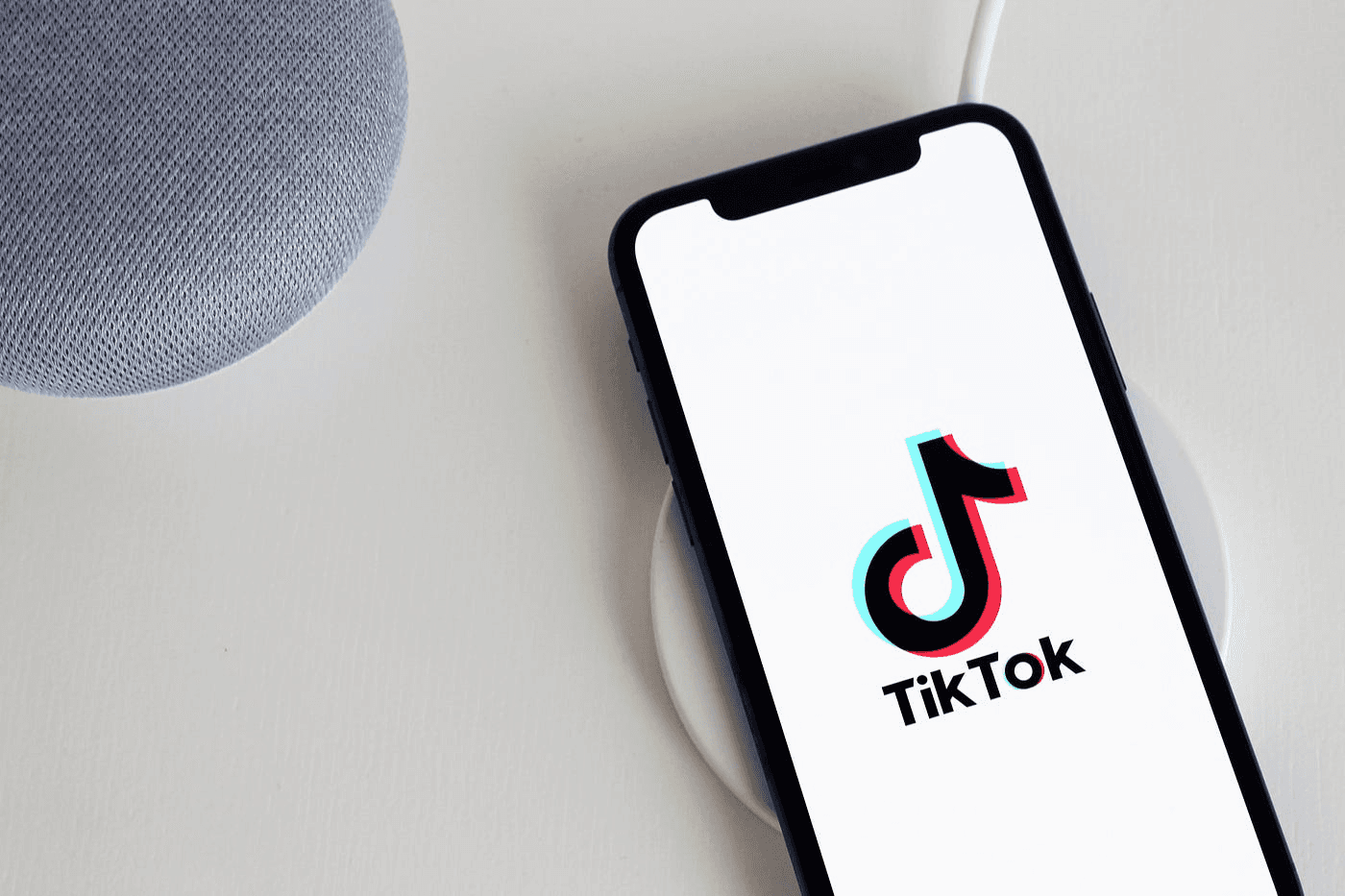TikTok logo displayed on phone - How Much Do Content Creators Make on TikTok