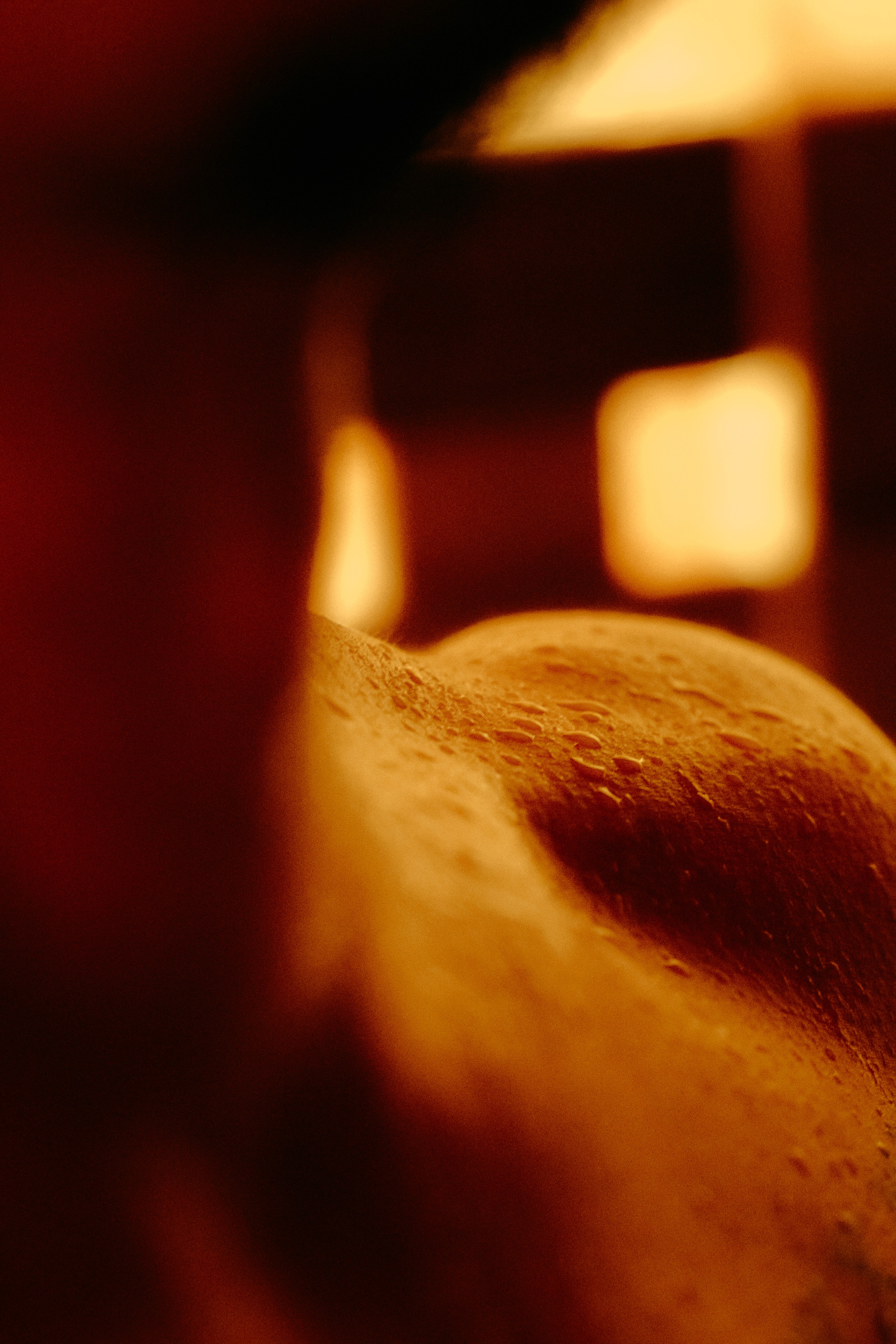Close-up of warm amber light filtering through the AetherHaus Himalayan salt sauna at low intensity