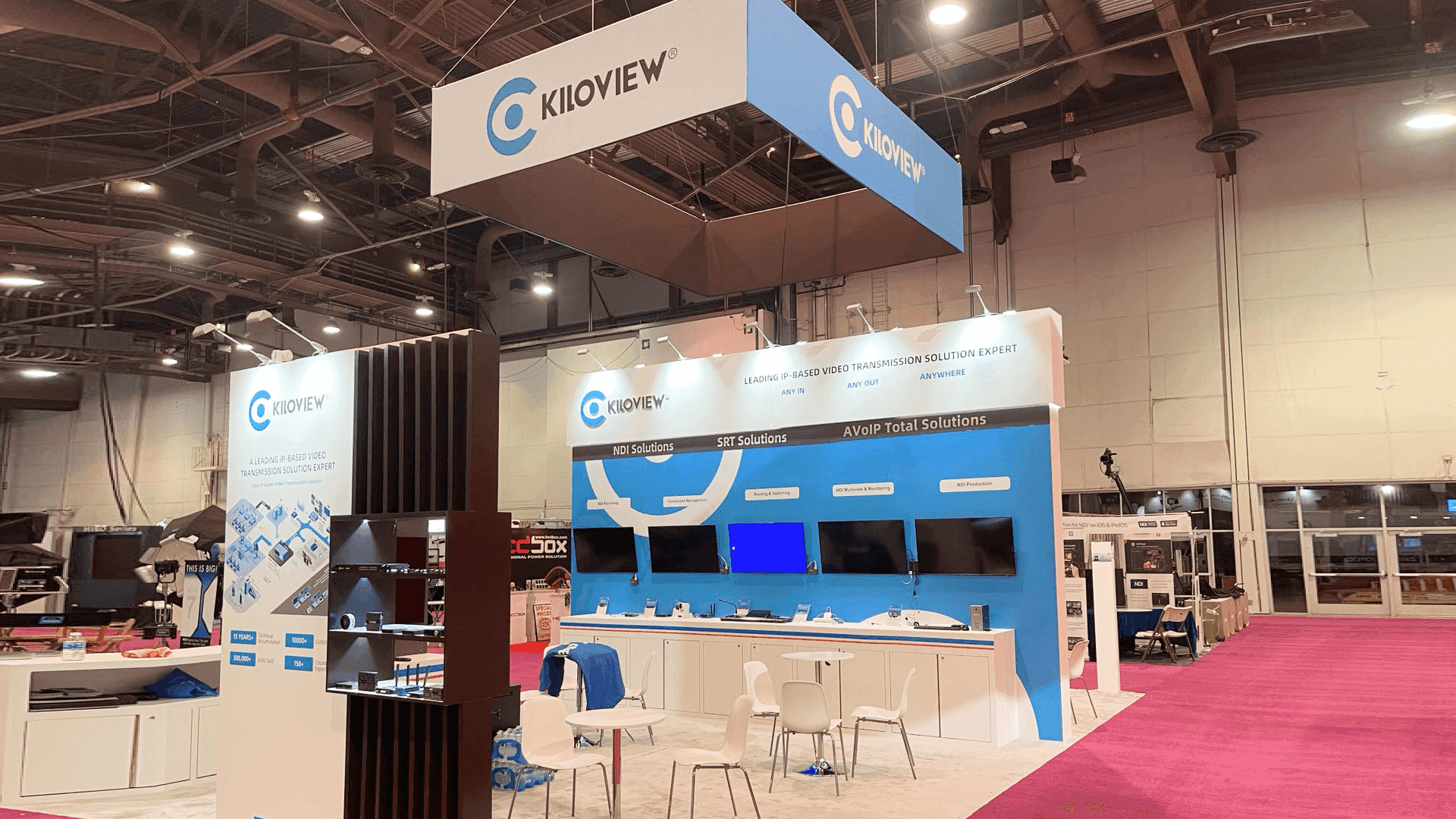 Kiloview NAB Show 2023 20x20 booth at Las Vegas Convention Center with PTZ camera display, hanging sign coordination, and video device demo stations