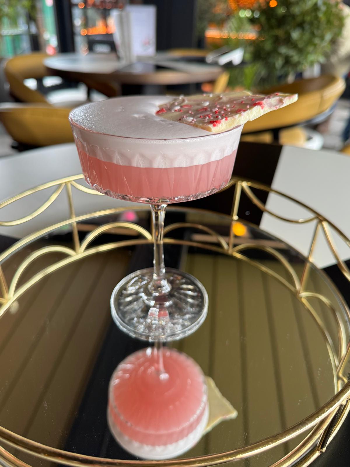Love Club cocktail on mirror tray