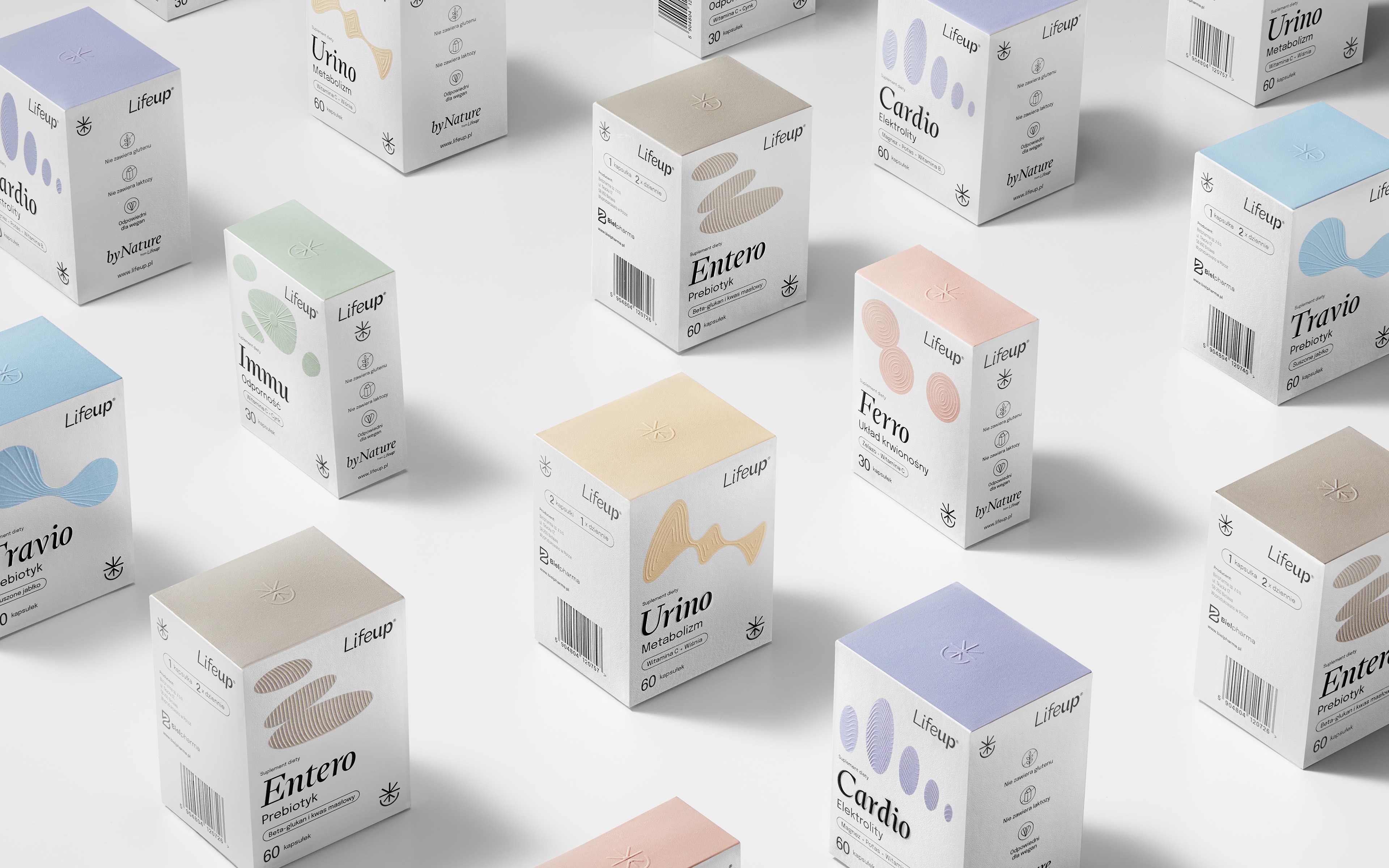 Lifeup® supplement packaging line-up of Cardio, Immu, Ferro, Travio, Entero and Urino boxes on a white studio table