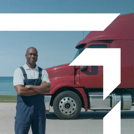 Truck driver standing confidently in front of a red semi-truck near a lake — representing GIA Group, LLC’s Workers’ Compensation and Occupational Accident Insurance coverage.
