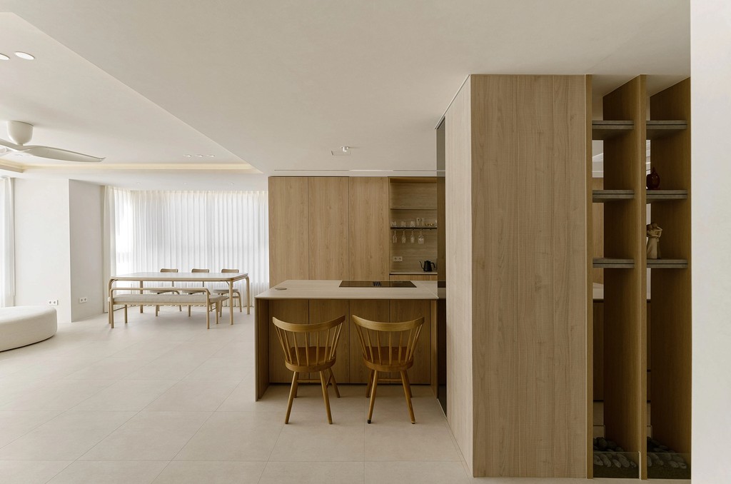 A living room filled with furniture and a flat screen TV