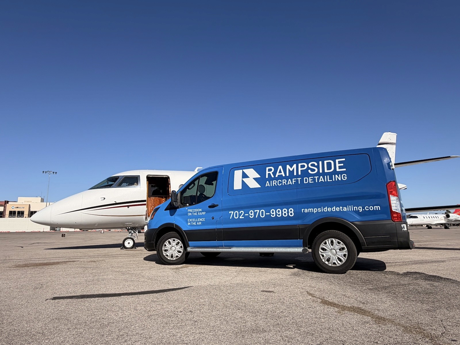 Rampside Aircraft Detailing service van beside a private jet in Las Vegas