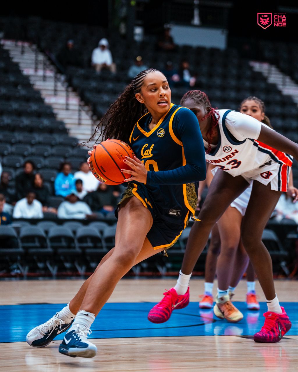 Three people sitting on a couch in a room looking at mobile devices