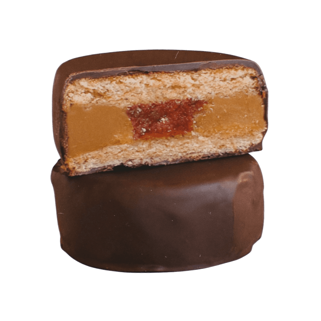 Alfajor Madre – lime-zested biscuits filled with Biscoff and red berries, coated in dark chocolate – Madre Bakers, Camden, London.