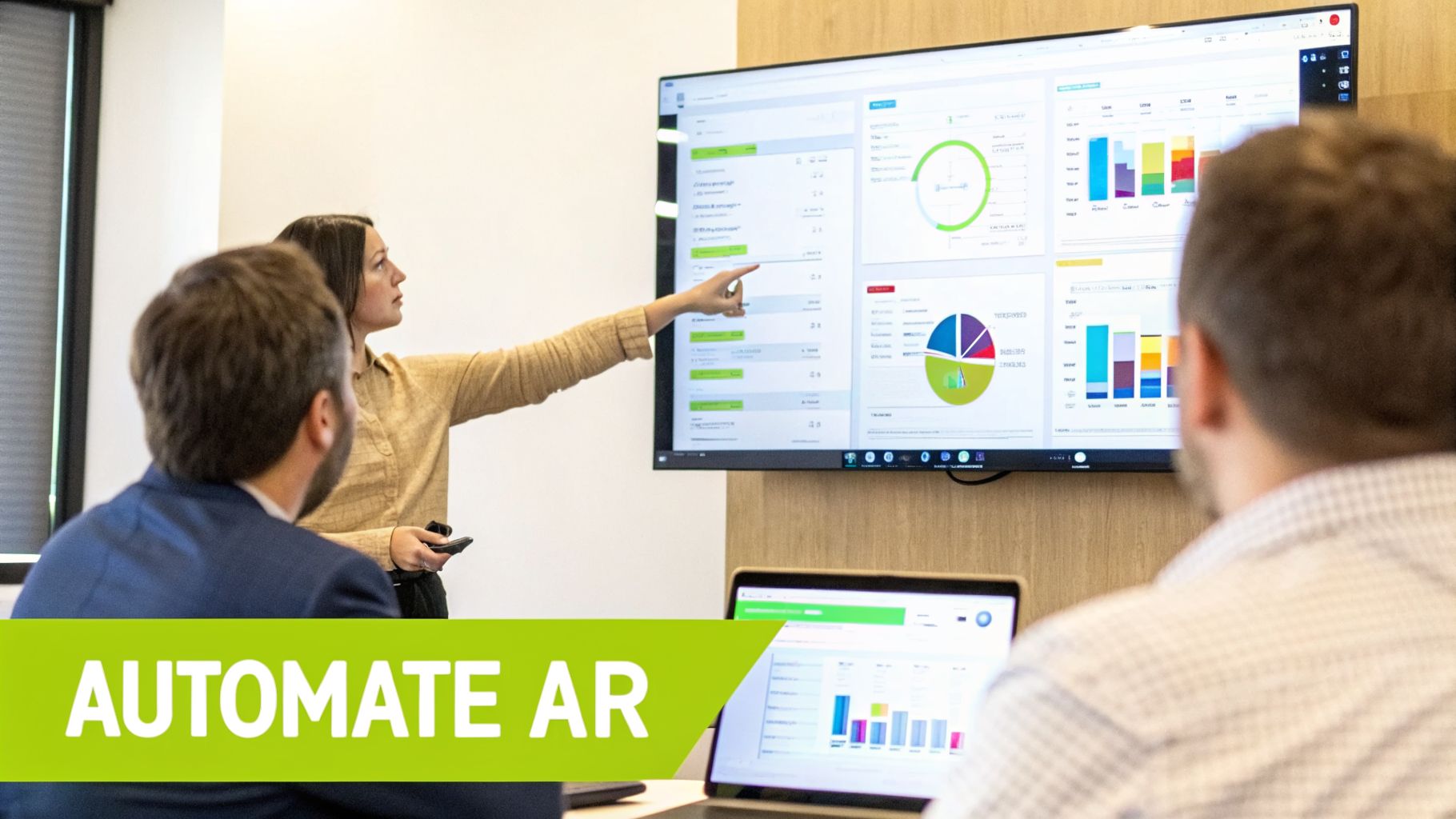 A woman presents financial data and charts on a large screen to two male colleagues.