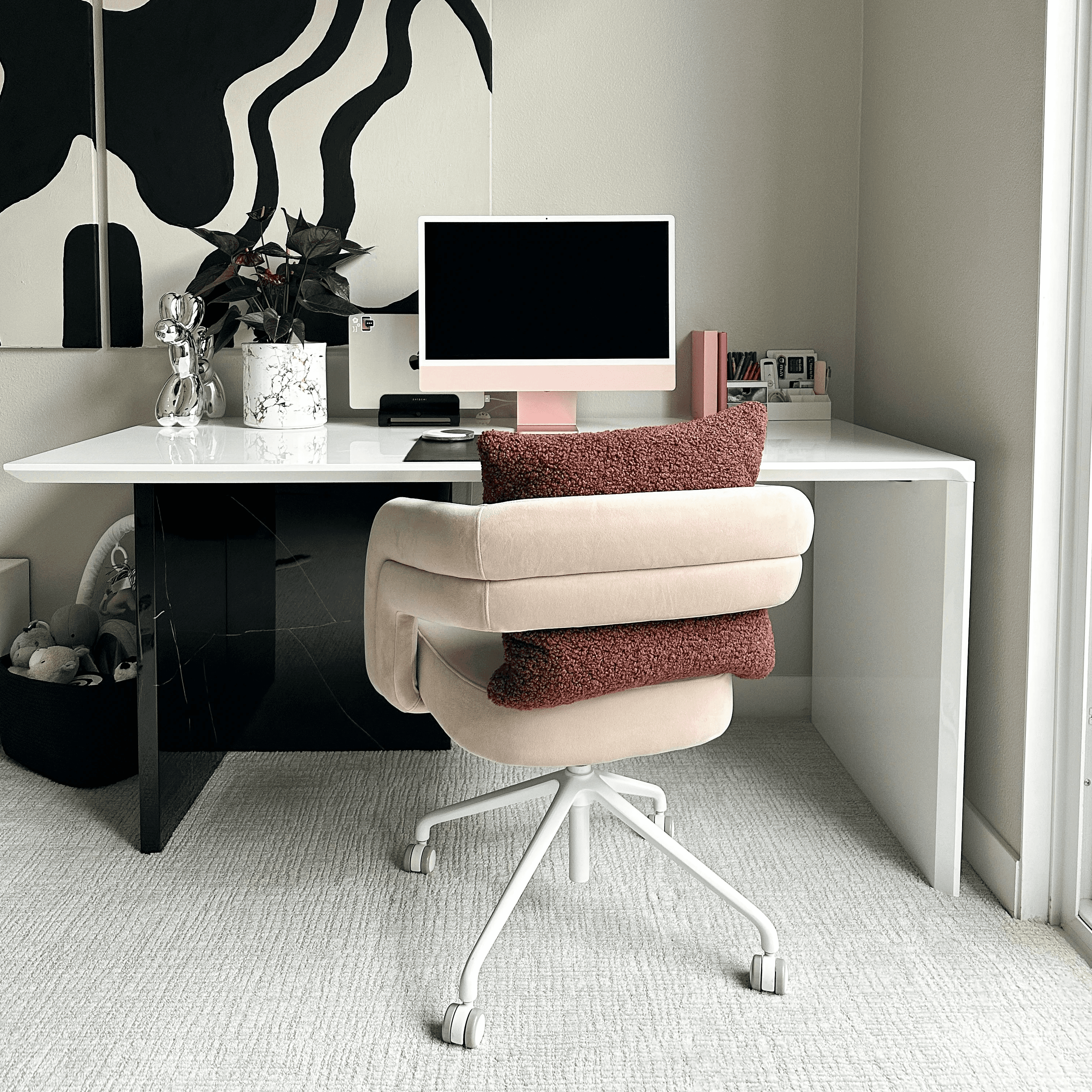 a desk with a computer and a chair
