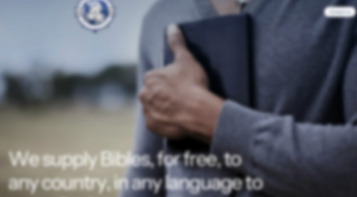 Person wearing orange sunglasses with dramatic orange and red lighting effects creating an artistic portrait